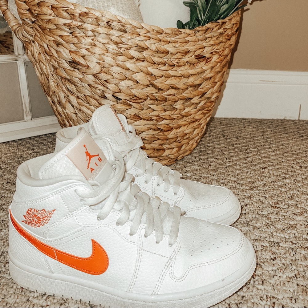 Red and white Nike air Jordans